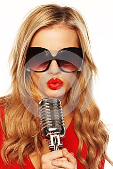 Gorgeous Blonde In Sunglasses With Microphone photo
