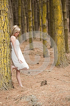 Gorgeous blonde teen girl in forest