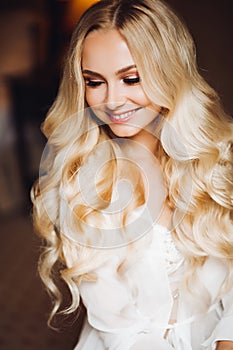 Gorgeous blondie bride dreaming and smiling.