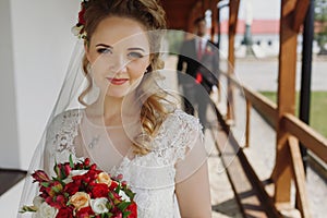 Gorgeous bride and groom smiling and posing outdoors. luxury wed