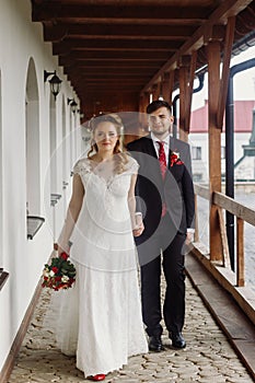 Gorgeous bride and groom smiling and posing outdoors. luxury wed