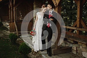 Gorgeous bride and groom smiling and posing outdoors. luxury wed