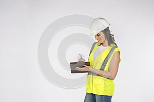 Gorgeous Brunette Construction Worker Posing Against A White Background