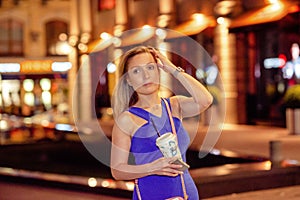 gorgeous brunette girl portrait in night city lights.