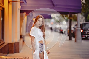 gorgeous brunette girl portrait in night city lights.