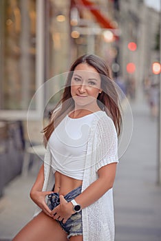 gorgeous brunette girl portrait in night city lights.