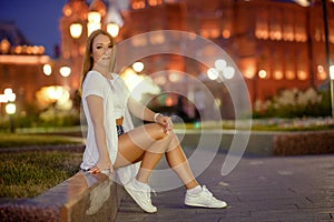 gorgeous brunette girl portrait in night city lights.