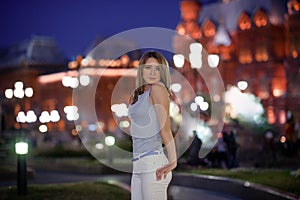 gorgeous brunette girl portrait in night city lights.