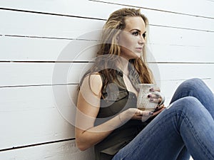 Gorgeous brunette woman drinking coffee