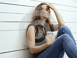 Gorgeous brunette woman drinking coffee