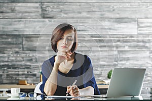 Gorgeous business woman working on project