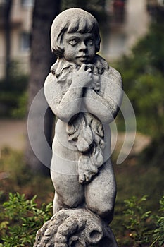 Gorgeous buttery smooth bokeh of Voigtlander 75mm. Vintage stylization of photo. Statuette with detailed reliefs