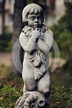 Gorgeous buttery smooth bokeh of Voigtlander 75mm. Vintage stylization of photo. Statuette with detailed reliefs photo