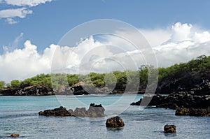 Gorgeous clouds reflecting in waters of Waialea  beach