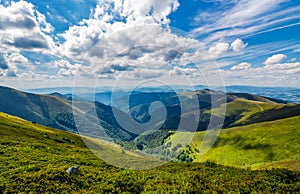 Gorgeous cloudscape over the grassy hillside photo