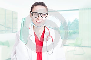 Gorgeous doctor showing two fingers photo