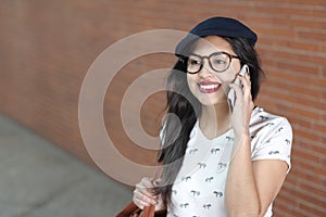 Gorgeous ethnic woman calling by phone