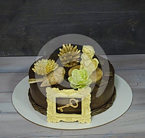 Gorgeous extra chocolate cake with succulents and an angel