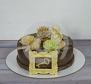 Gorgeous extra chocolate cake with succulents and an angel