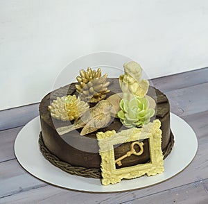 Gorgeous extra chocolate cake with succulents and an angel