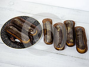 Gorgeous extra chocolate eclairs with gilded glaze