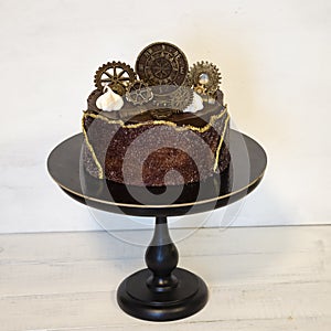 Gorgeous extra chocolate steam punk cake with gilded glaze
