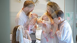 Gorgeous Family Of Six Kissing Newborn Twin Babies