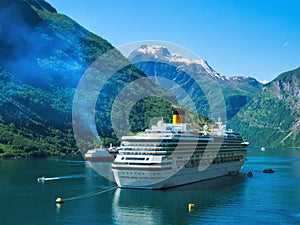 Gorgeous Geiranger Norway with fjord mountains snow waterfalls cruise ship