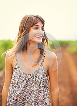 Gorgeous girl walking in the field, Summer Lifestyle