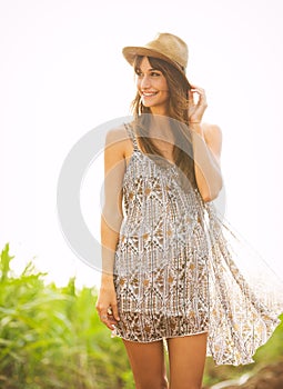 Gorgeous girl walking in the field, Summer Lifestyle