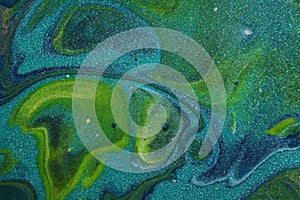 Gorgeous glittering teal dominates this abstract acrylic painting for backgrounds.