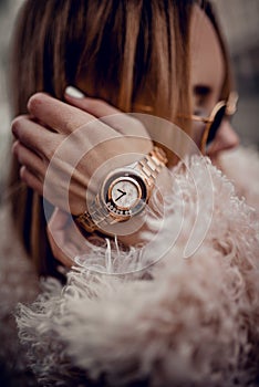 Gorgeous golden watch on woman hand