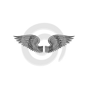 Gorgeous heraldic bird or angel wings with gray feathers. Tattoo artwork. Vector element for sticker, t-shirt print