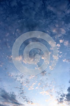 Gorgeous image of daybreak, with puffy white clouds on bright blue sky