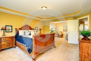 Gorgeous Interior of master bedroom with carved wood bed