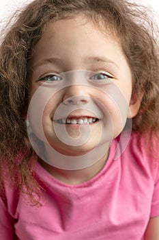 Gorgeous kid showing her white teeth
