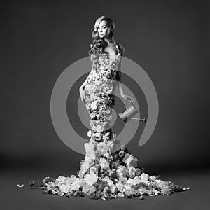 Gorgeous lady in dress of flowers