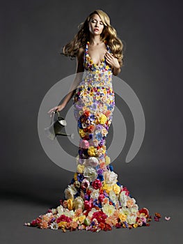 Gorgeous lady in dress of flowers