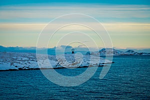 Gorgeous landscape of coastal scenes ofcoast covered with snow on Hurtigruten during voyage in a good weather