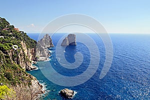 Gorgeous landscape of famous faraglioni rocks on Capri island, Italy.