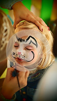 Gorgeous little girl rabbit face painting Easter