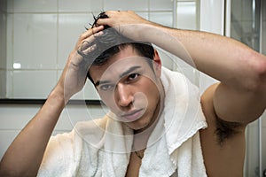 Gorgeous Man after his Shower Holding his Head