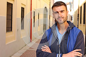 Gorgeous man looking at camera outdoors