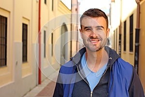Gorgeous man looking at camera outdoors