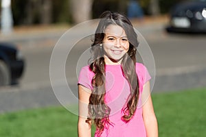 Gorgeous me. Happy girl sunny outdoors. Child girl with cute smile. Small girl with long curly hair. Little girl in