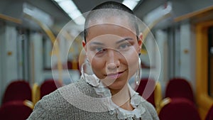 Gorgeous model standing train looking camera confidently close up portrait