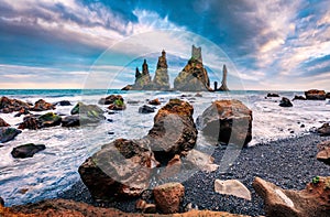 Gorgeous morning scene of black sand beach in Iceland, Vik location, Europe. Splendid summer sunrise on Reynisdrangar cliffs in At