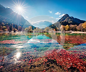 Gorgeous morning view of Jasna lake. Stunning autumn scene of Julian Alps, Gozd Martuljek location, Slovenia, Europe. Wonderful la