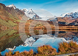 Gorgeous morning view of Stellisee lake with Stockhorn peak on background. Great autumn scene of Swiss Alps, Zermatt resort locati