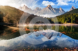 Gorgeous mountain lake in autumn fog photo